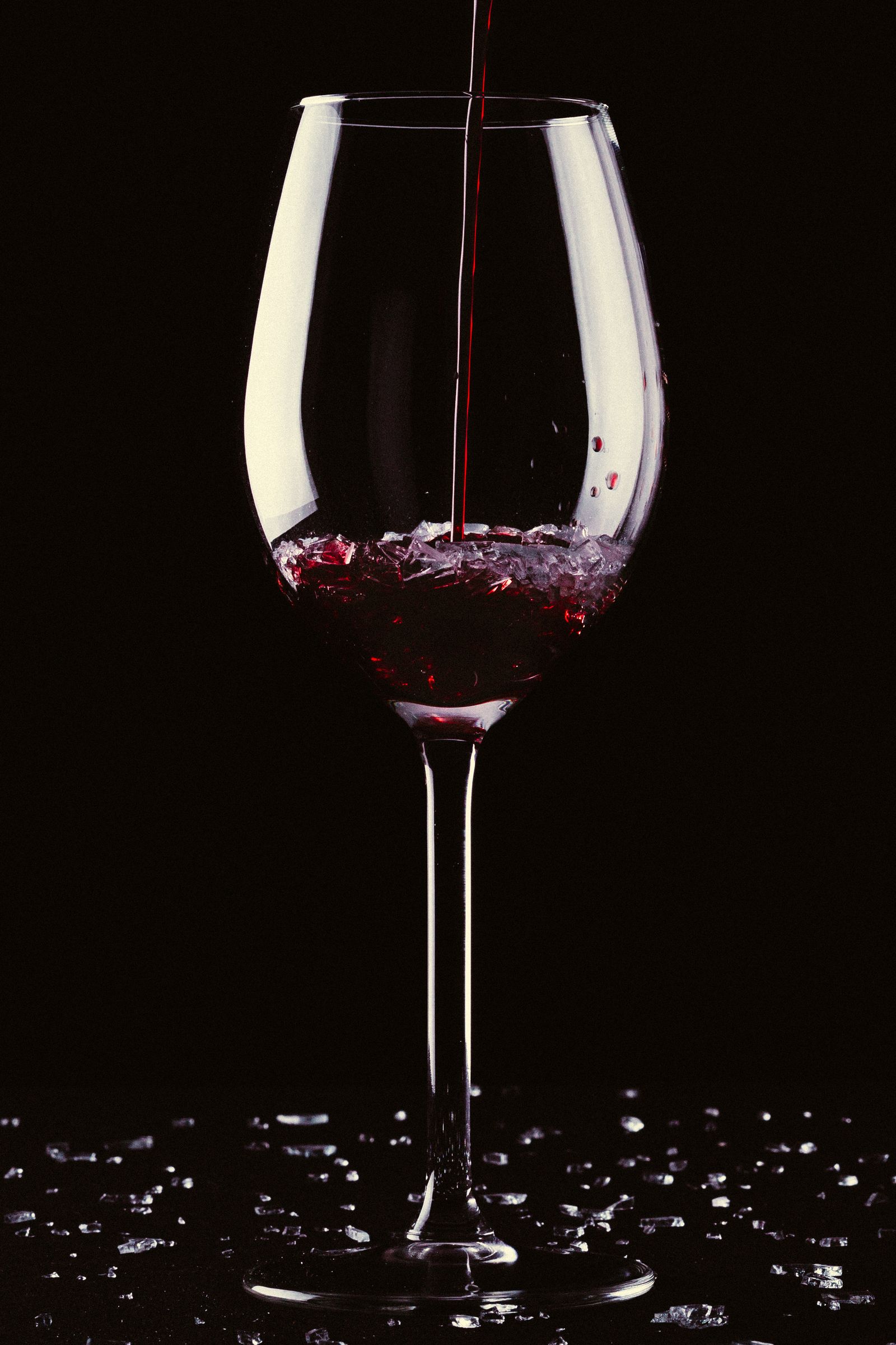 Red wine poured into a glass
